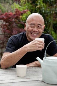 Celebrity Chef Ken Hom smiling and drinking green tea