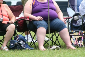 Obese woman in purple vest